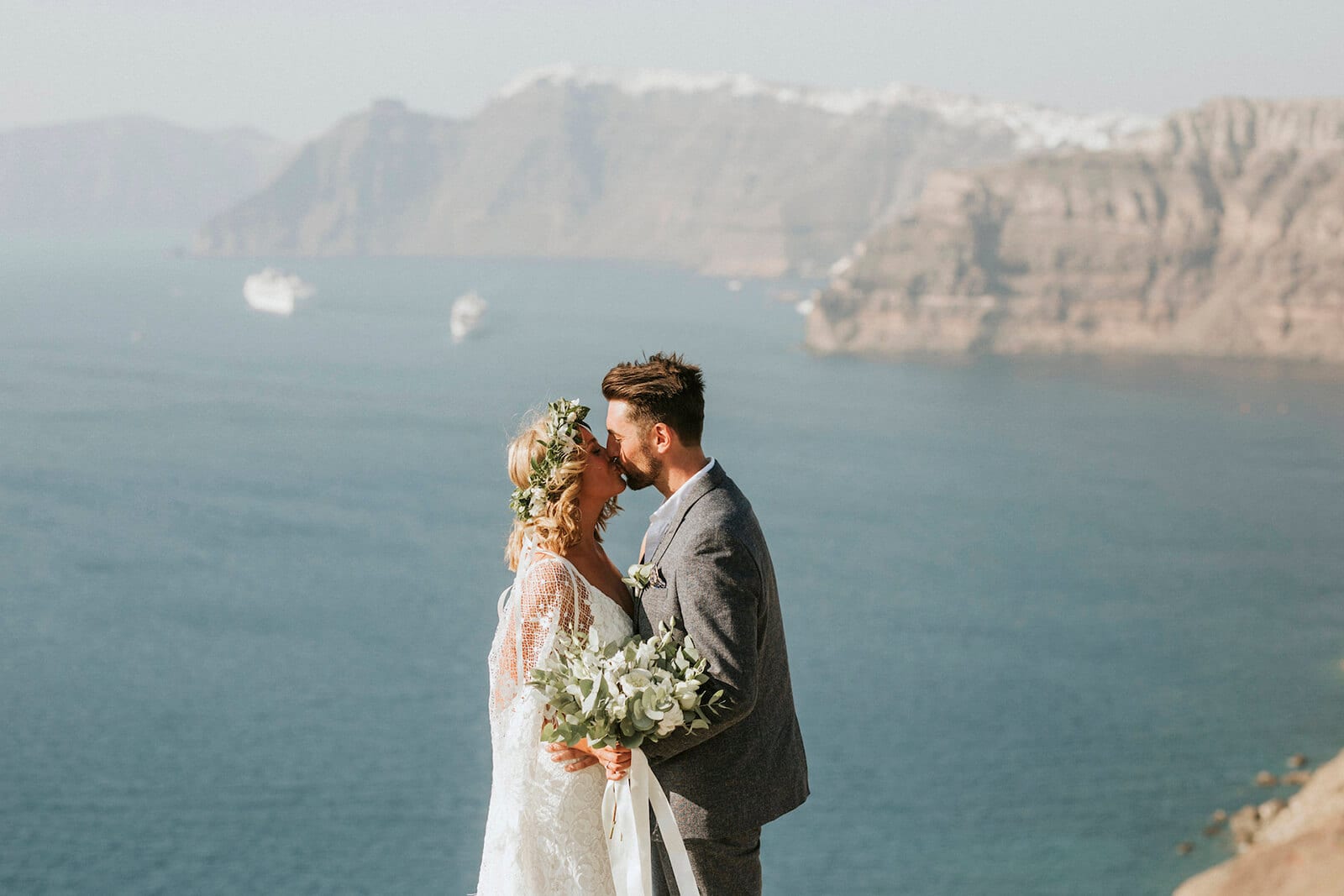Bride wearing Grace Loves Lace Verdelle 2.0 Gown kissing groom