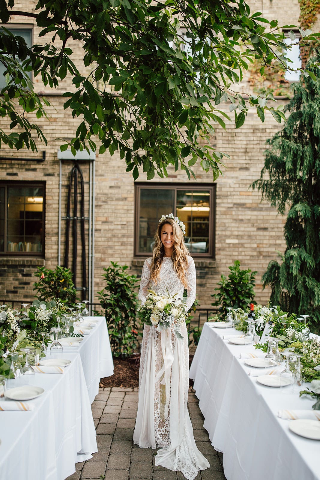 Bride wearing Grace Loves Lace Inca Gown holding bouquet